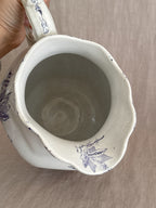 Looking down into the jug interior with the cream glaze visible