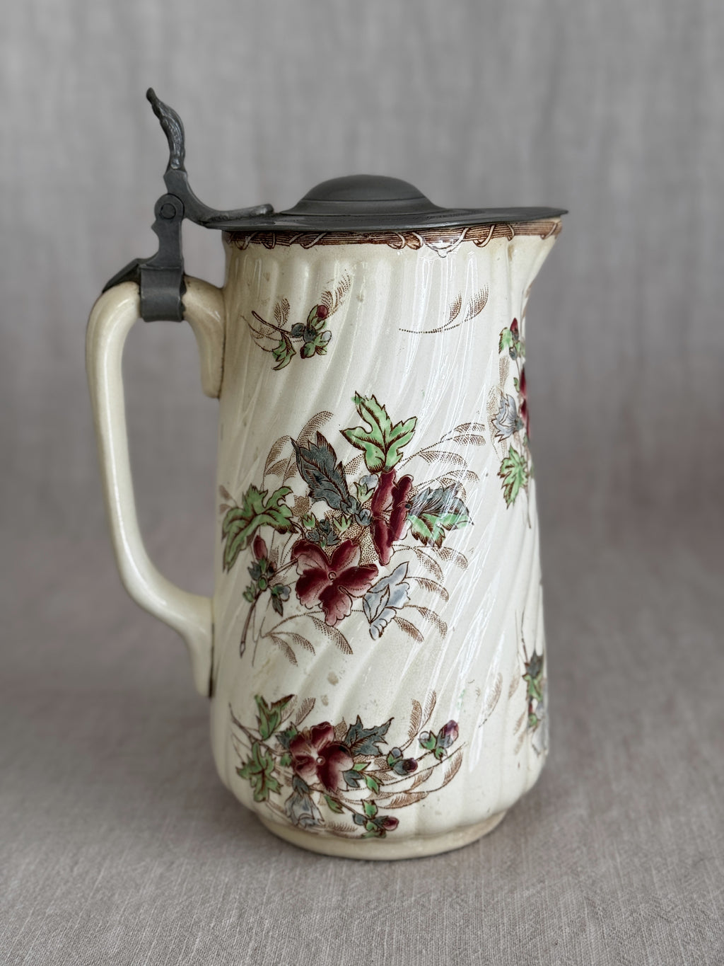 The jug seen from the other side showing the spiralled ribbing and loop handle