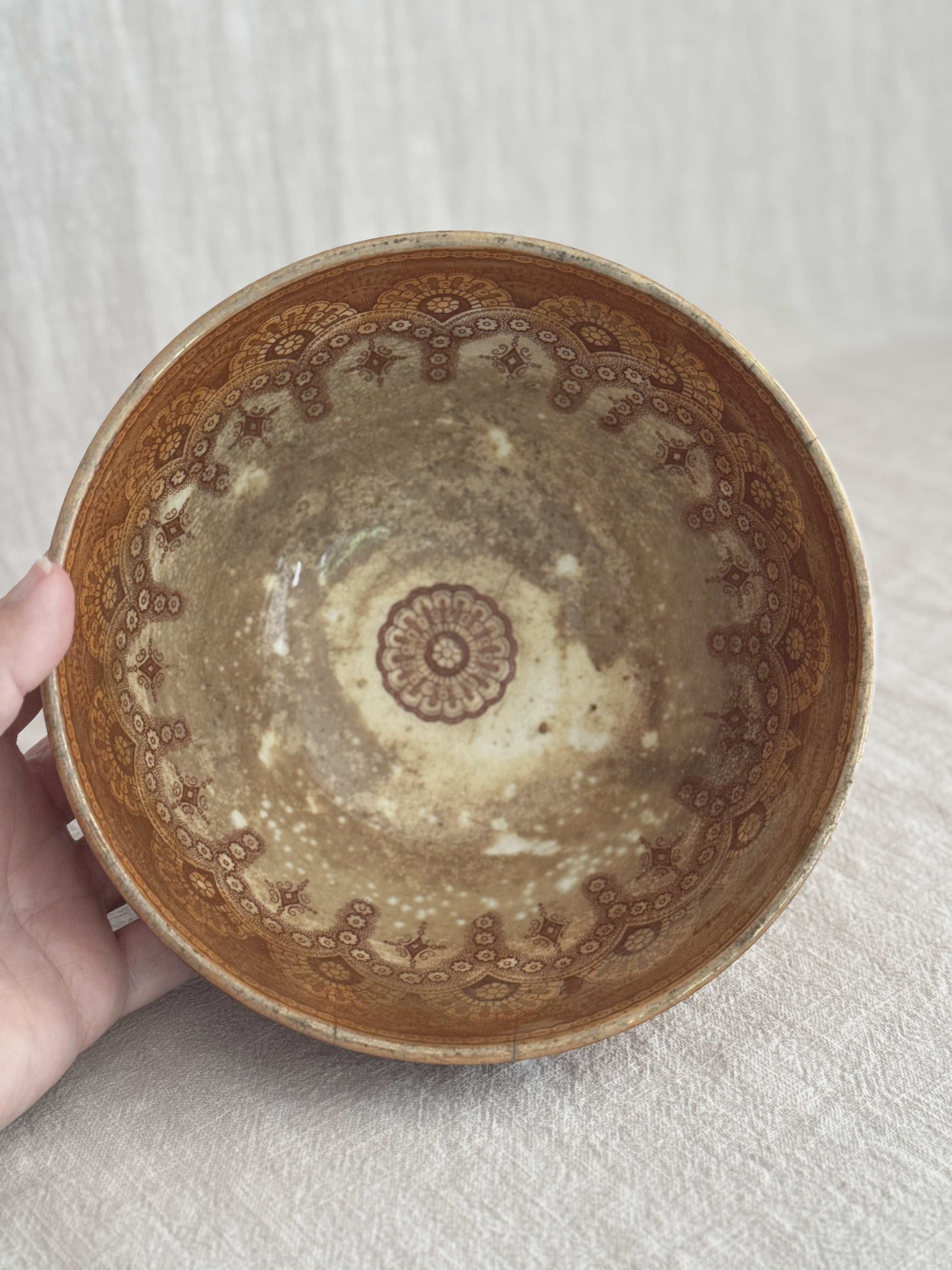Detail of the lustre glaze showing the crazing and deep age staining