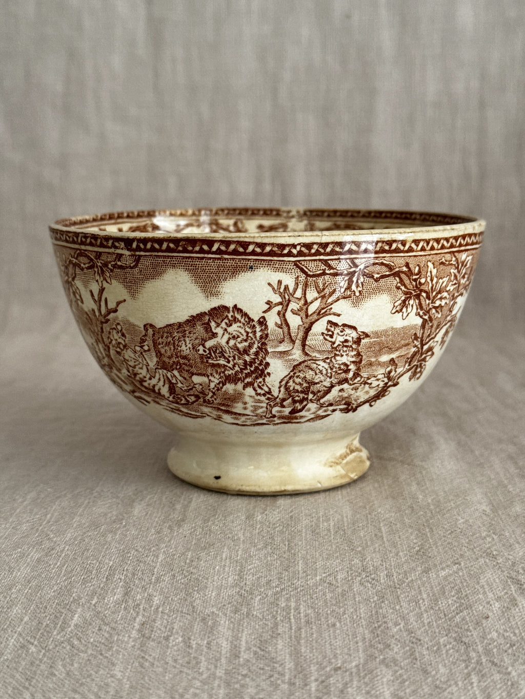 Underside angle of the footed bowl showing the pedestal foot and printed band