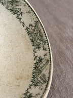 Close view of the interior rim border and the crazing in the cream glaze