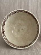Looking into one bowl showing the brown printed border and heavy crazing