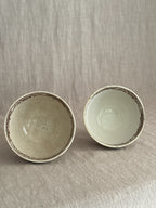 Both bowl interiors seen from above, showing the difference in patina between them
