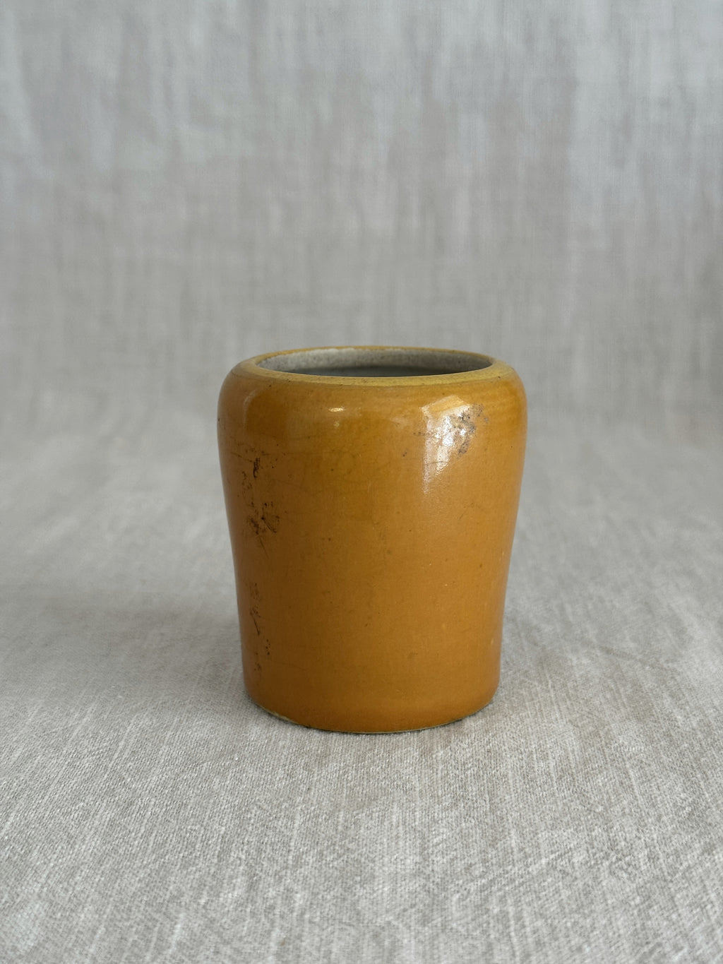 The ochre pot seen from above showing the glazed rim and interior