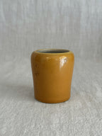 The ochre pot seen from above showing the glazed rim and interior