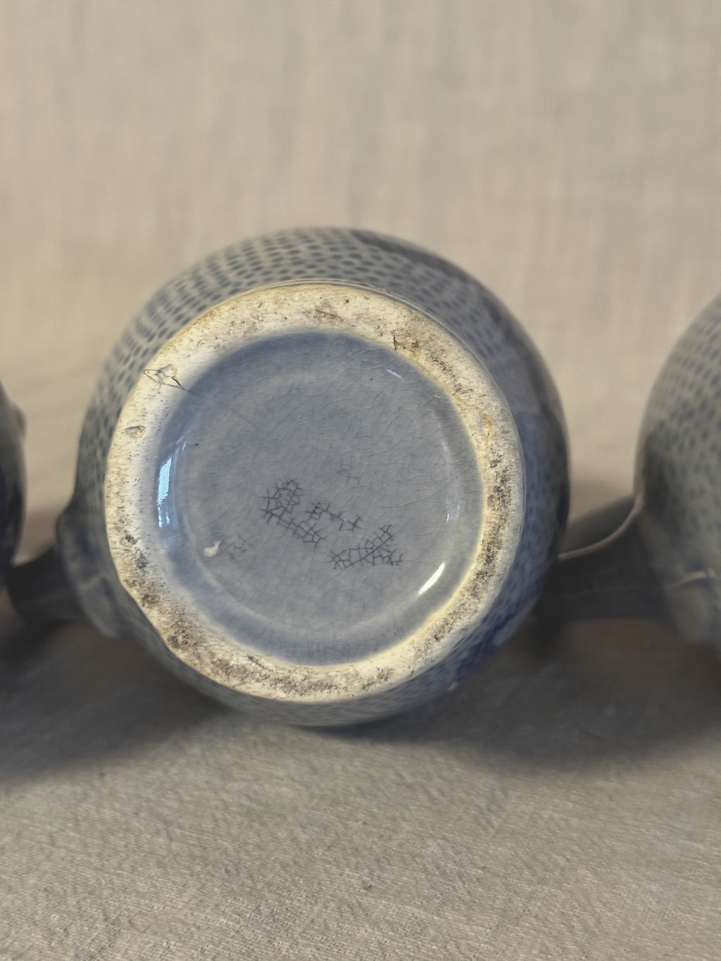 Unmarked base of one jug showing the grey-blue glaze and fine crazing