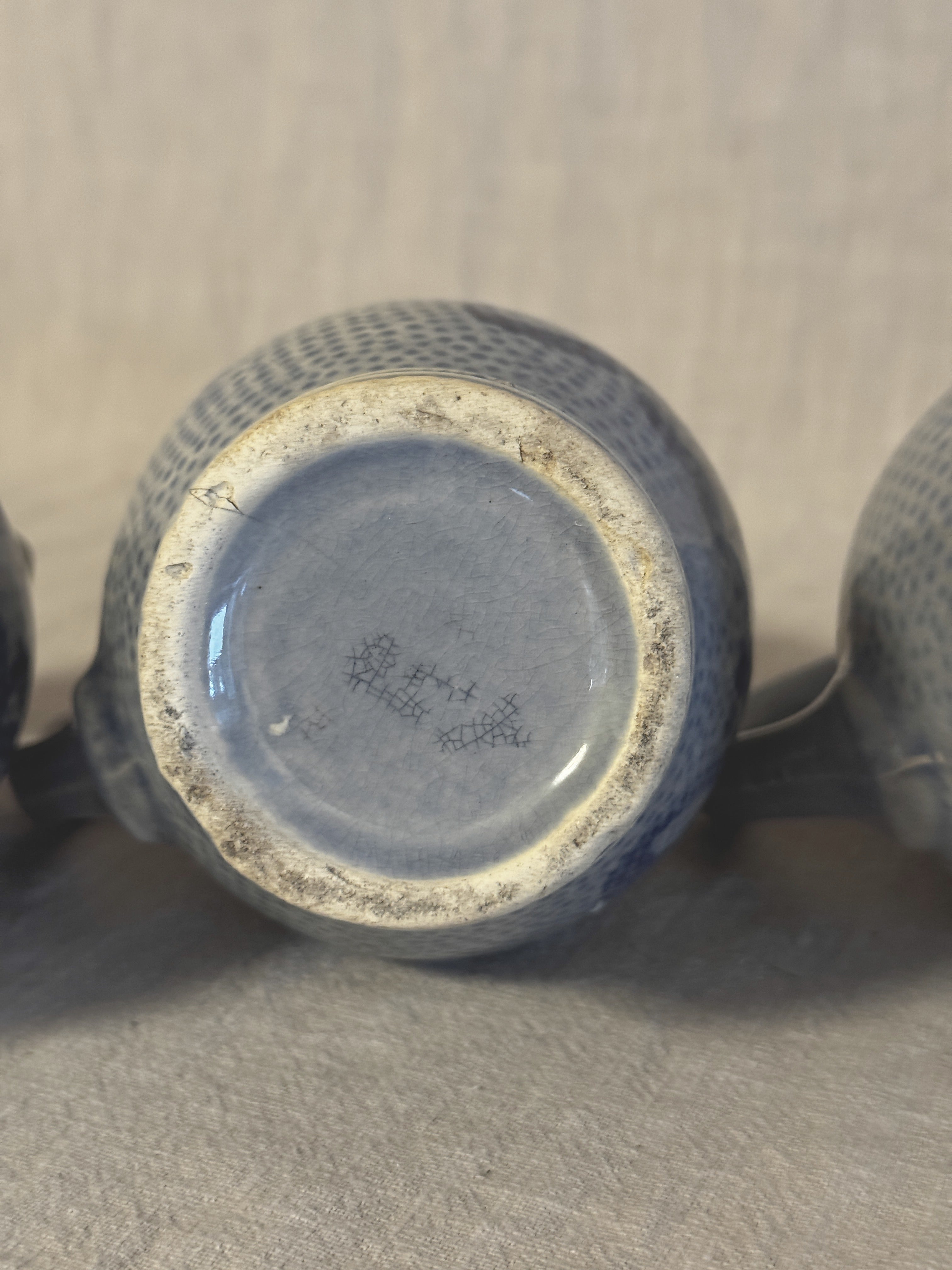 Unmarked base of one jug showing the grey-blue glaze and fine crazing