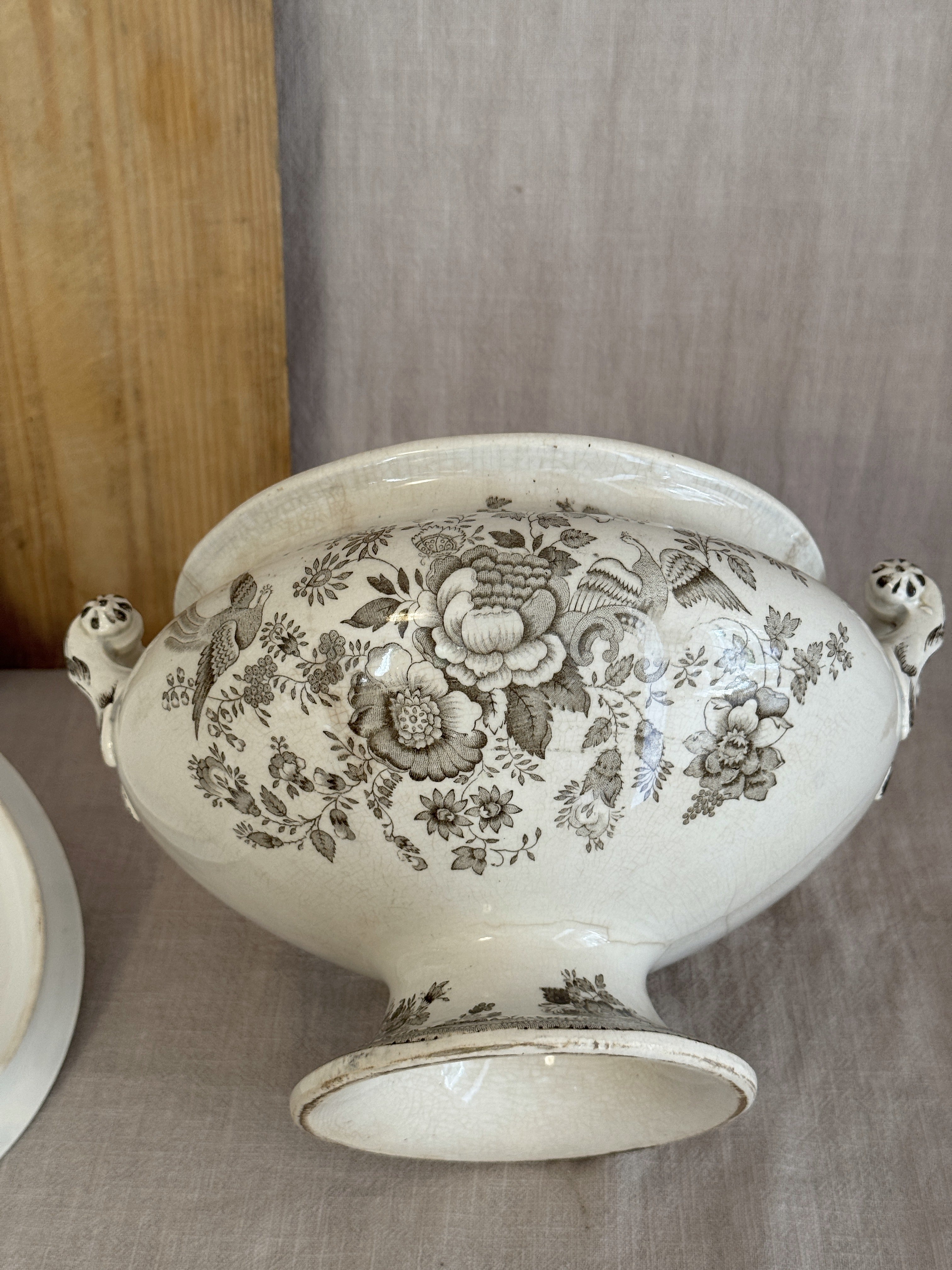 Close view of the brown pheasant and peony transfer across the body of the footed Swedish tureen
