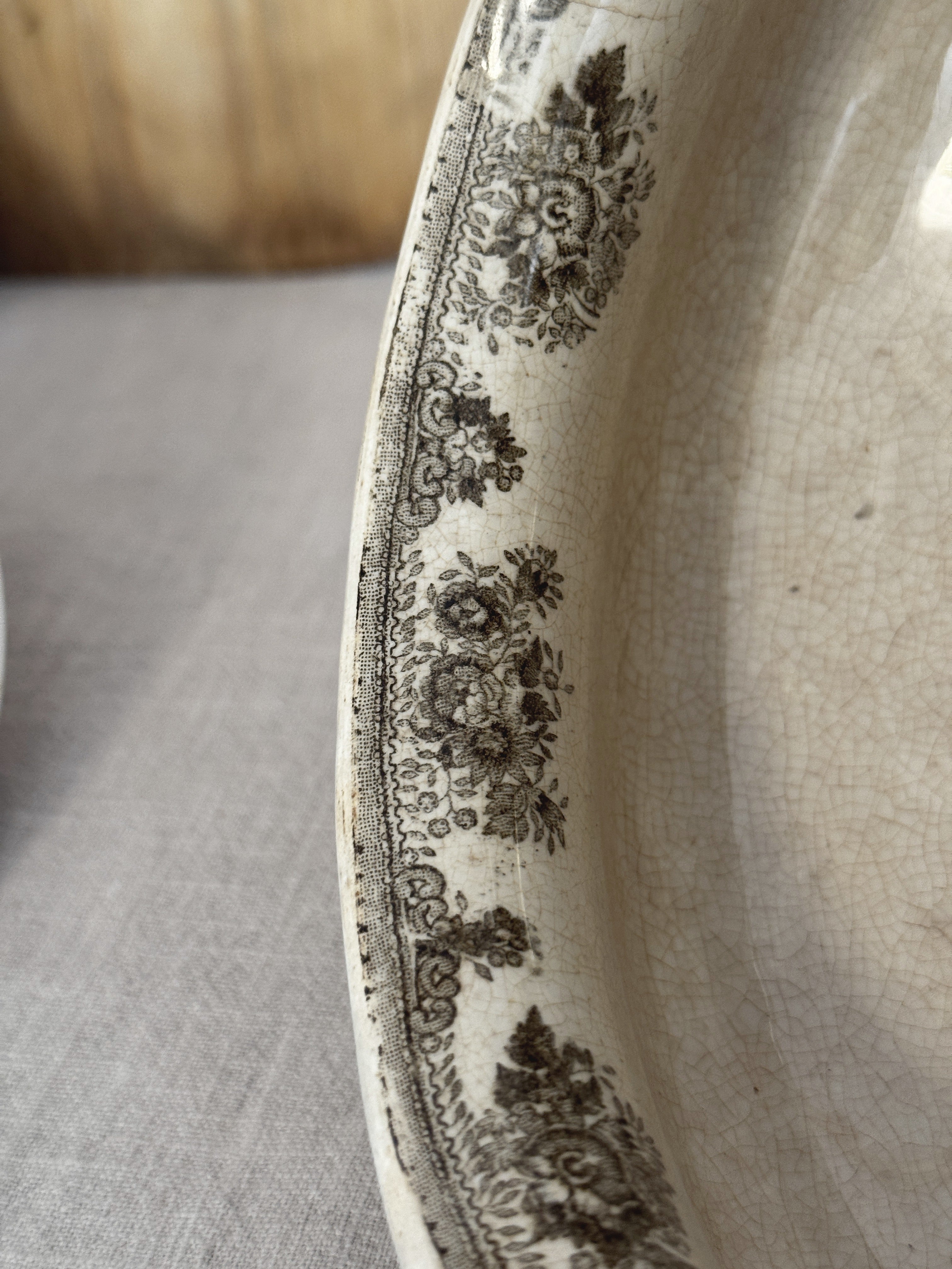 Detail of the brown diaper and floral border around the rim of the Swedish transferware tureen