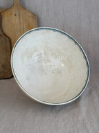 Interior of the antique Anna bowl, showing even crazing and warm tea-toned age spots across the glaze