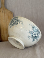 Antique Swedish flintware bowl tilted to show the low trumpet foot and the printed factory mark underneath