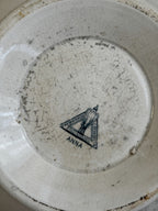 Close-up of the Göteborgs Porslinsfabrik factory mark with the Anna pattern name, printed in blue-green on the crazed base
