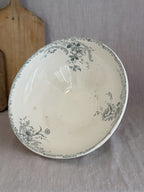Interior of the French terre de fer salad bowl, printed with sage green roses and rocaille scrolls