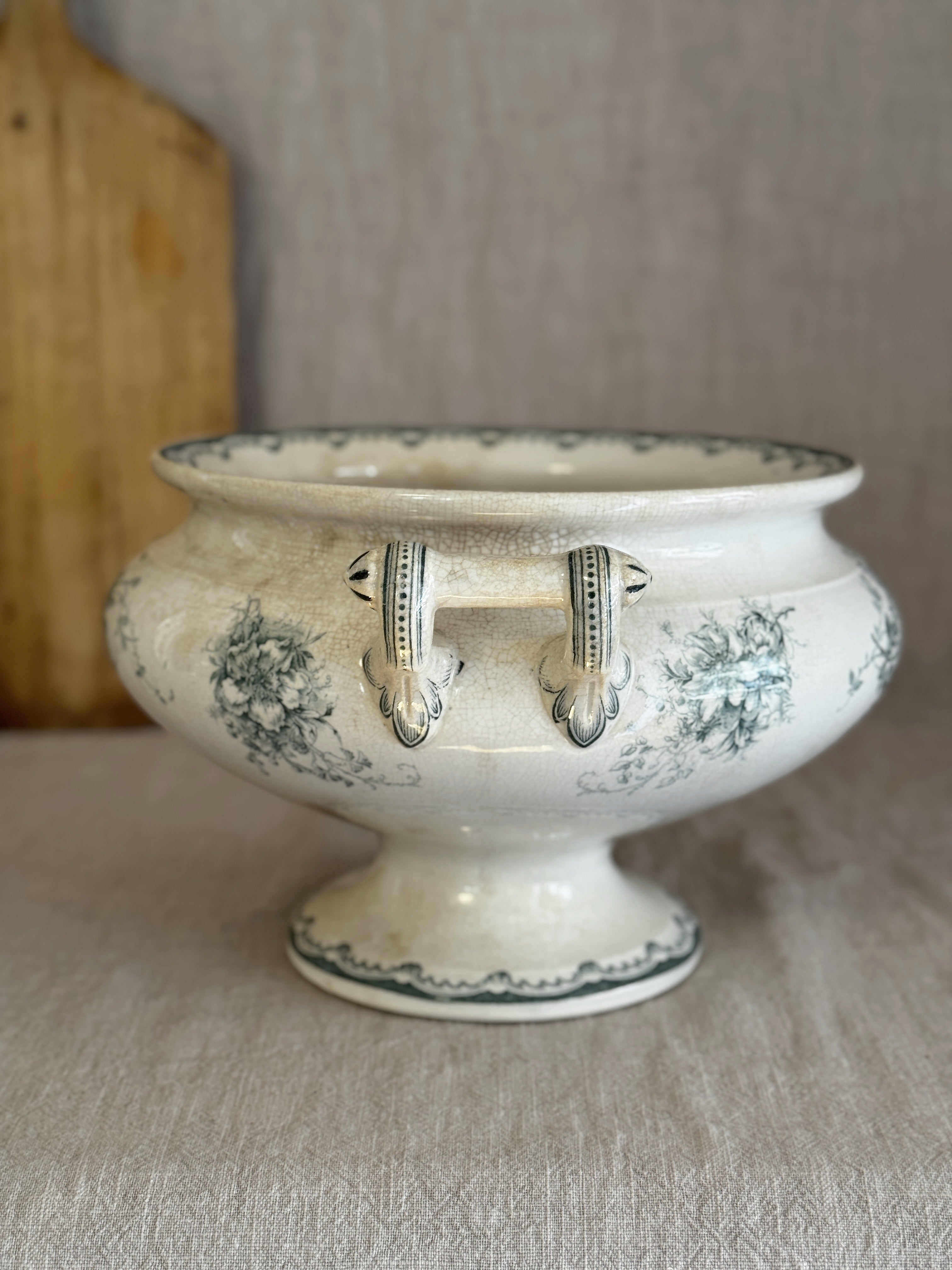 Swedish flintware pedestal bowl on its flaring foot, with wave border and amber crazing across the glaze