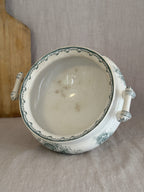 Looking down into the antique Anna bowl, showing the scrolled interior border and soft age spotting