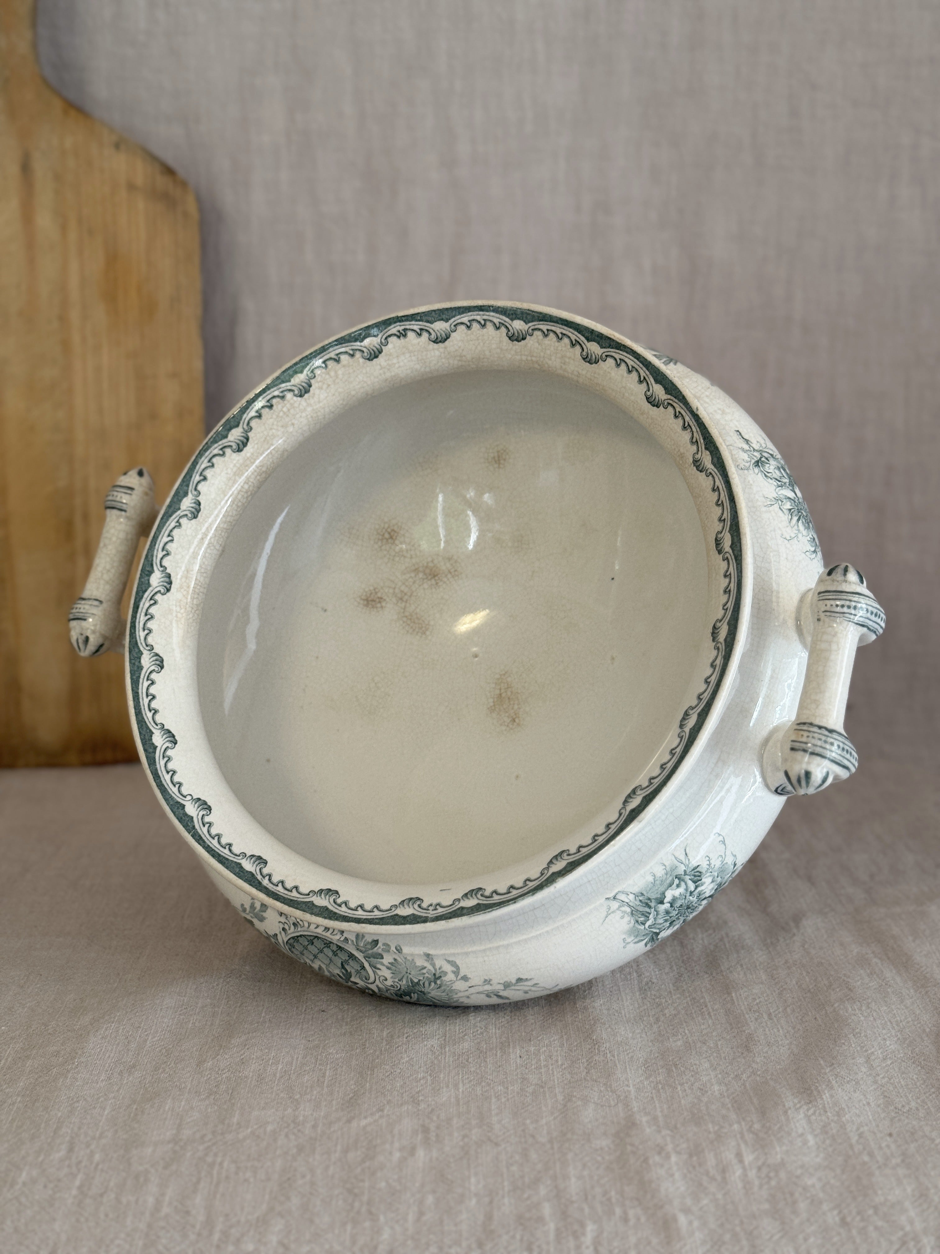 Looking down into the antique Anna bowl, showing the scrolled interior border and soft age spotting