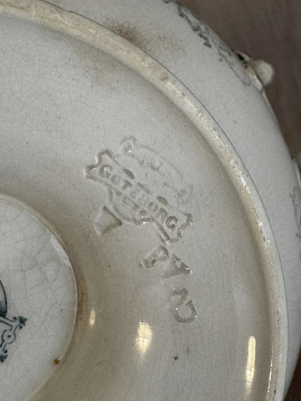 Detail of the impressed Göteborg mark in the clay on the base of the Swedish flintware bowl