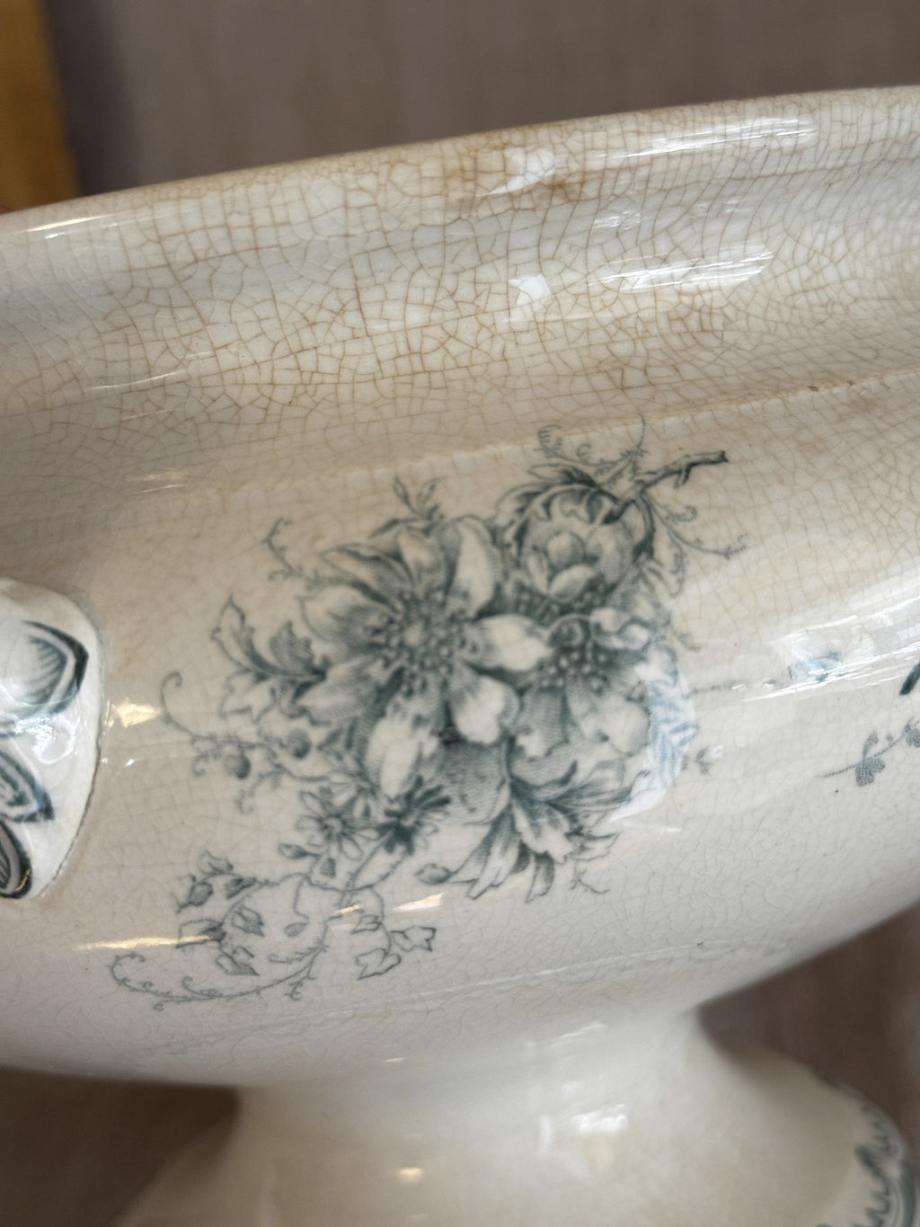 Detail of the blue-green floral bouquet transfer and fine amber crazing on the body of the bowl
