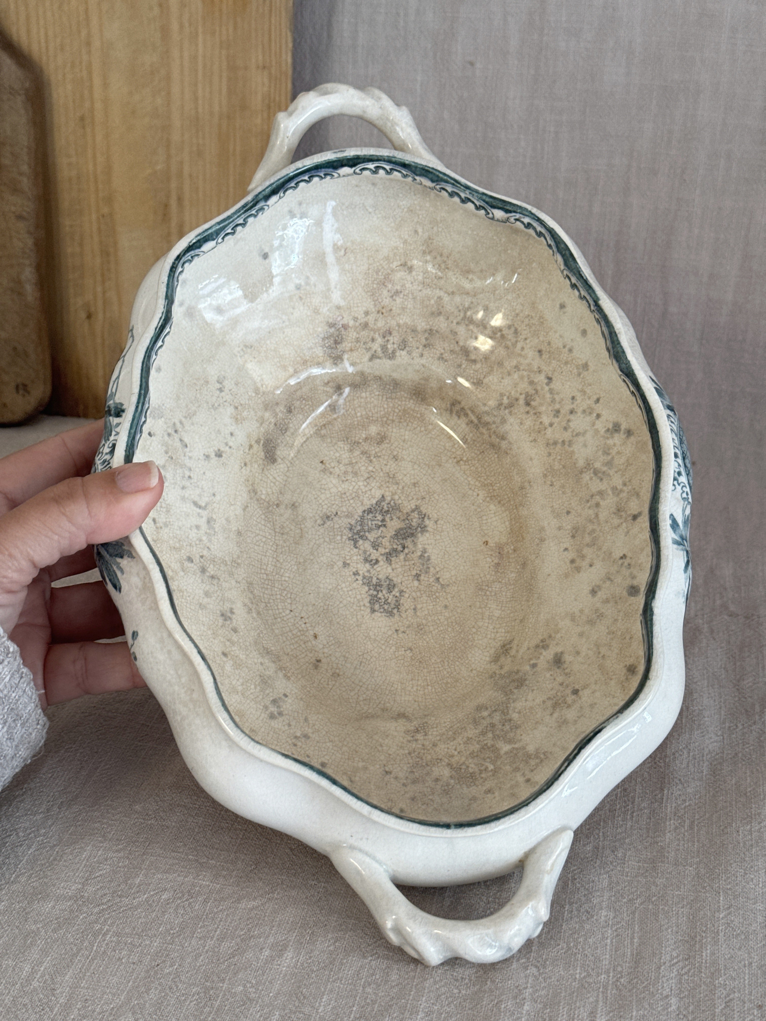Interior of the antique Swedish tureen showing warm honey crazing across the earthenware