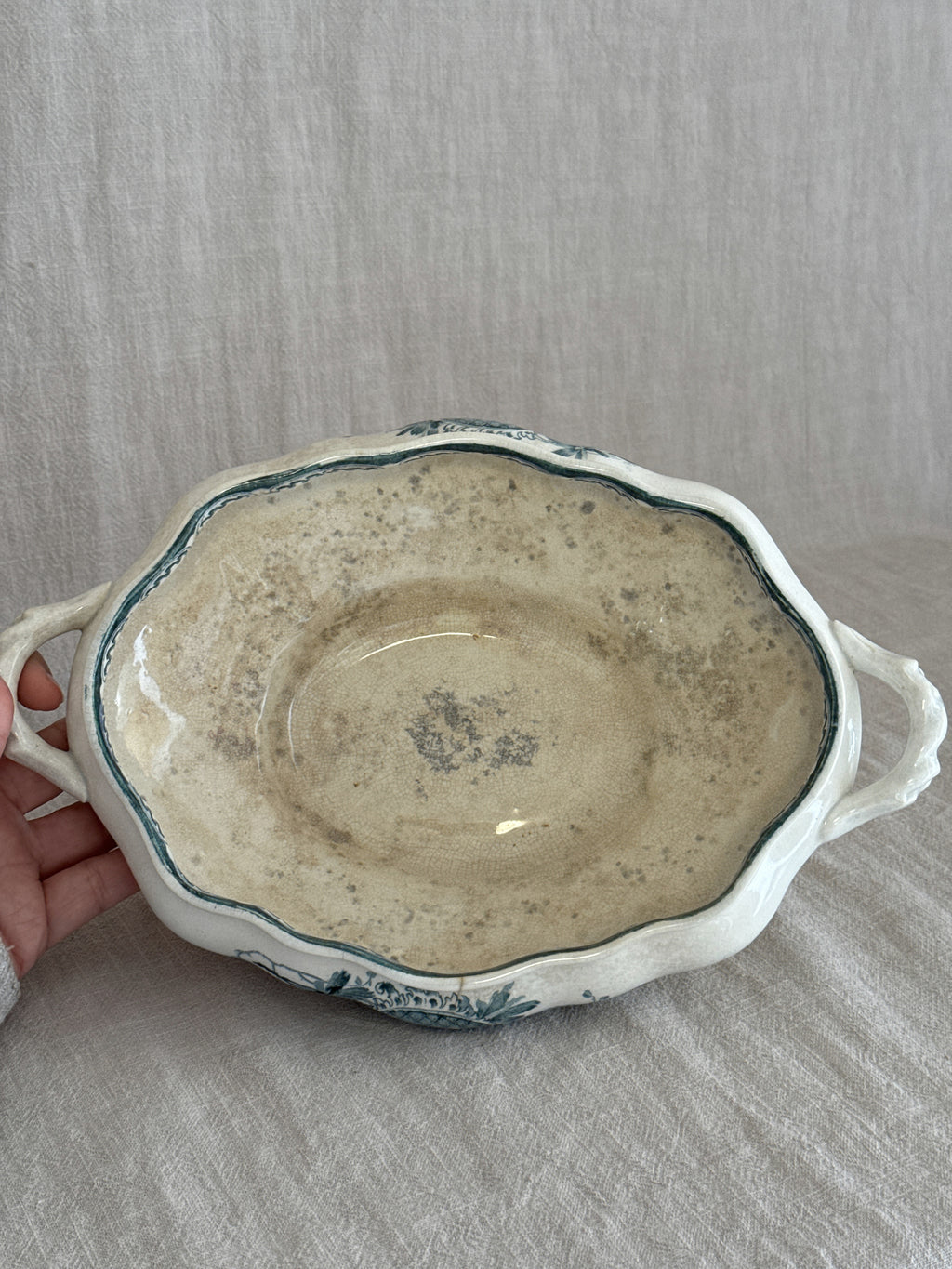 Anna pattern tureen held in the hand, interior with tea-toned crazing and age spotting