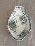 Antique Swedish ravier in teal transferware, the Anna pattern, seen from above on linen