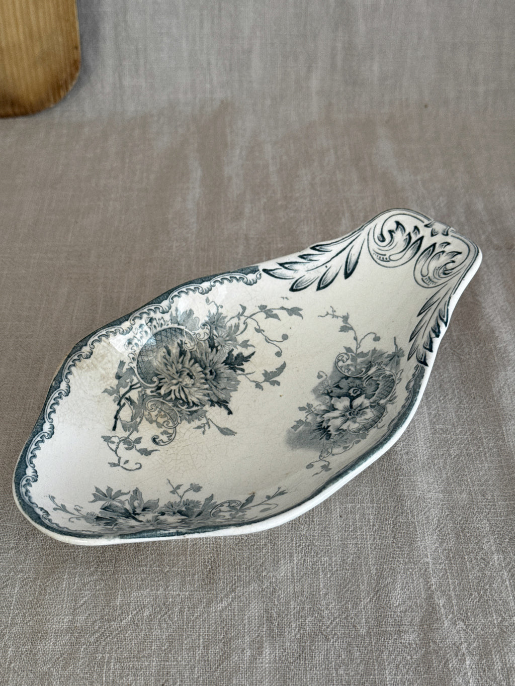 Swedish Anna transferware relish dish at an angle, showing the sculpted rocaille gable