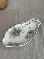Swedish Anna transferware relish dish at an angle, showing the sculpted rocaille gable