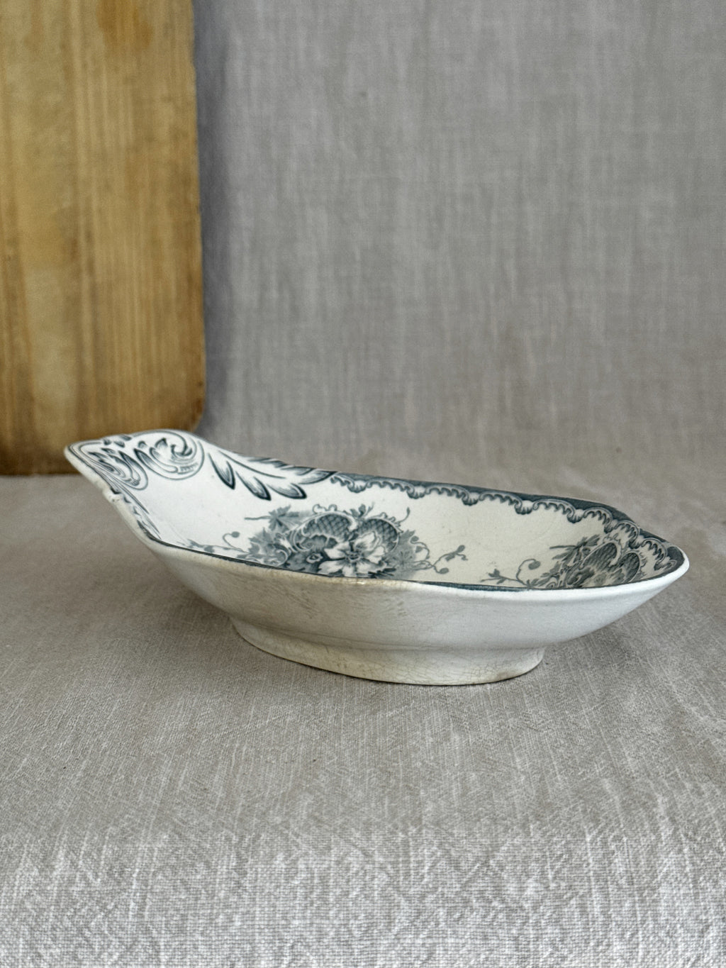 Side profile of the antique Swedish ravier on its low oval foot ring