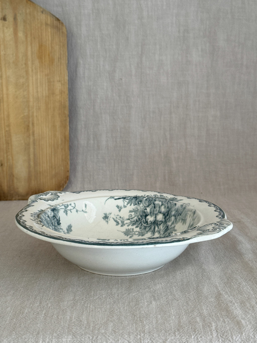 Antique Swedish Anna serving bowl in teal transferware seen from the side on linen