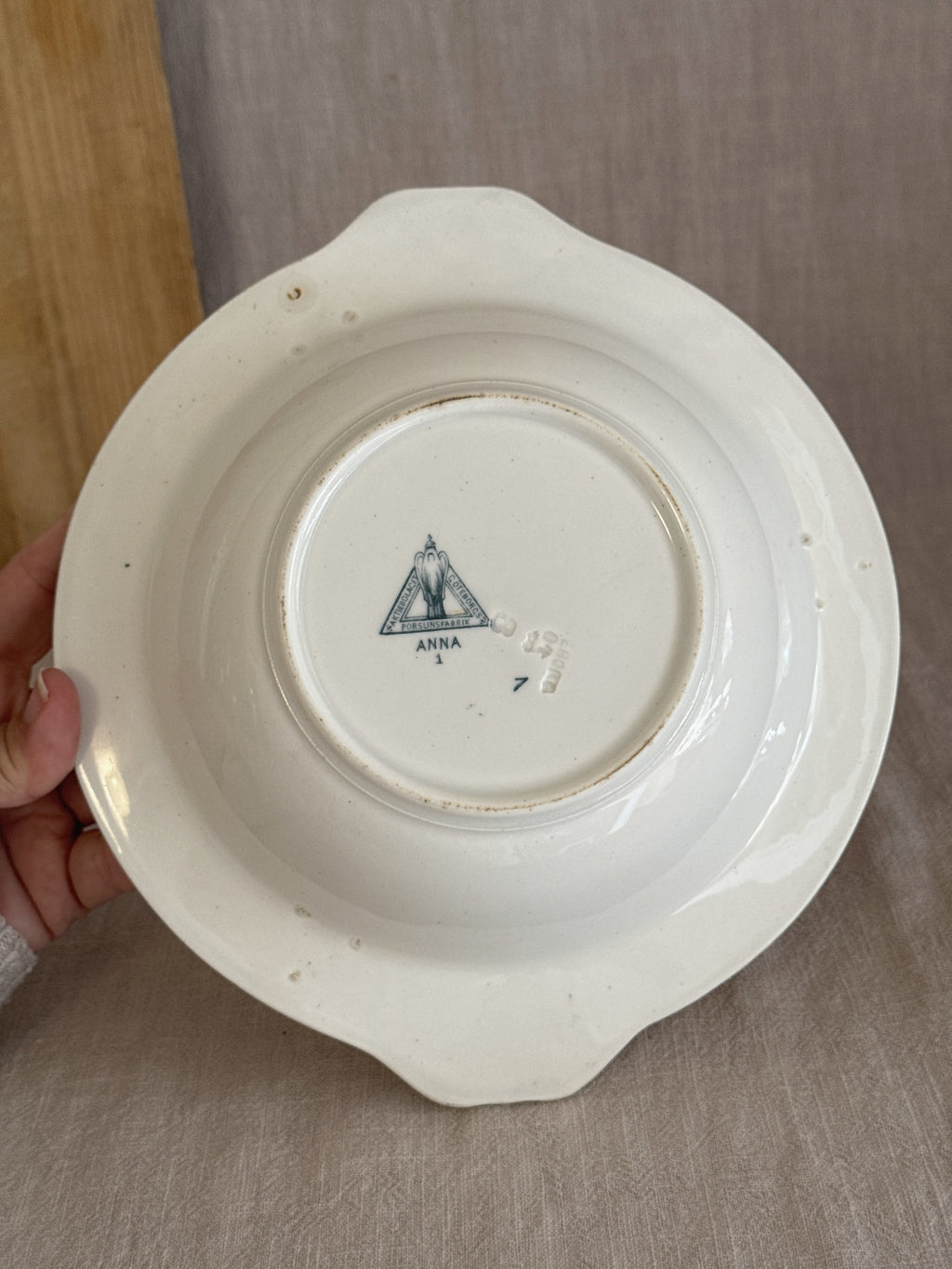 Base of the antique Swedish bowl showing the foot ring and the printed factory mark