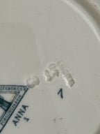 Close view of the printed ANNA mark and the impressed marks on the underside