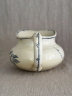 Back view of the jug with the bamboo-moulded handle hand-painted with dark blue nodes and small leaves