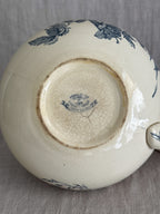 Underside of the jug showing the printed blue oval Gien mark reading Medailles d'Or, Faiencerie de Gien, on the finely crazed cream glaze