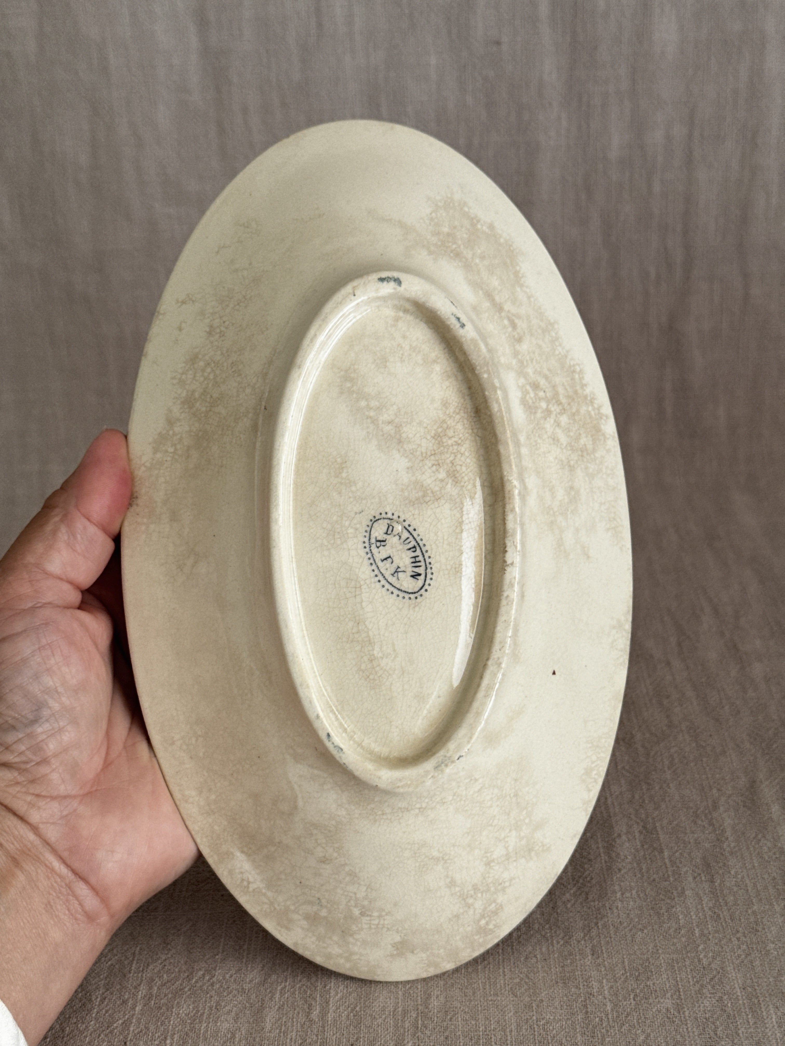 Underside of the dish with the printed maker's mark reading DAUPHIN over B.F.K. in a beaded oval