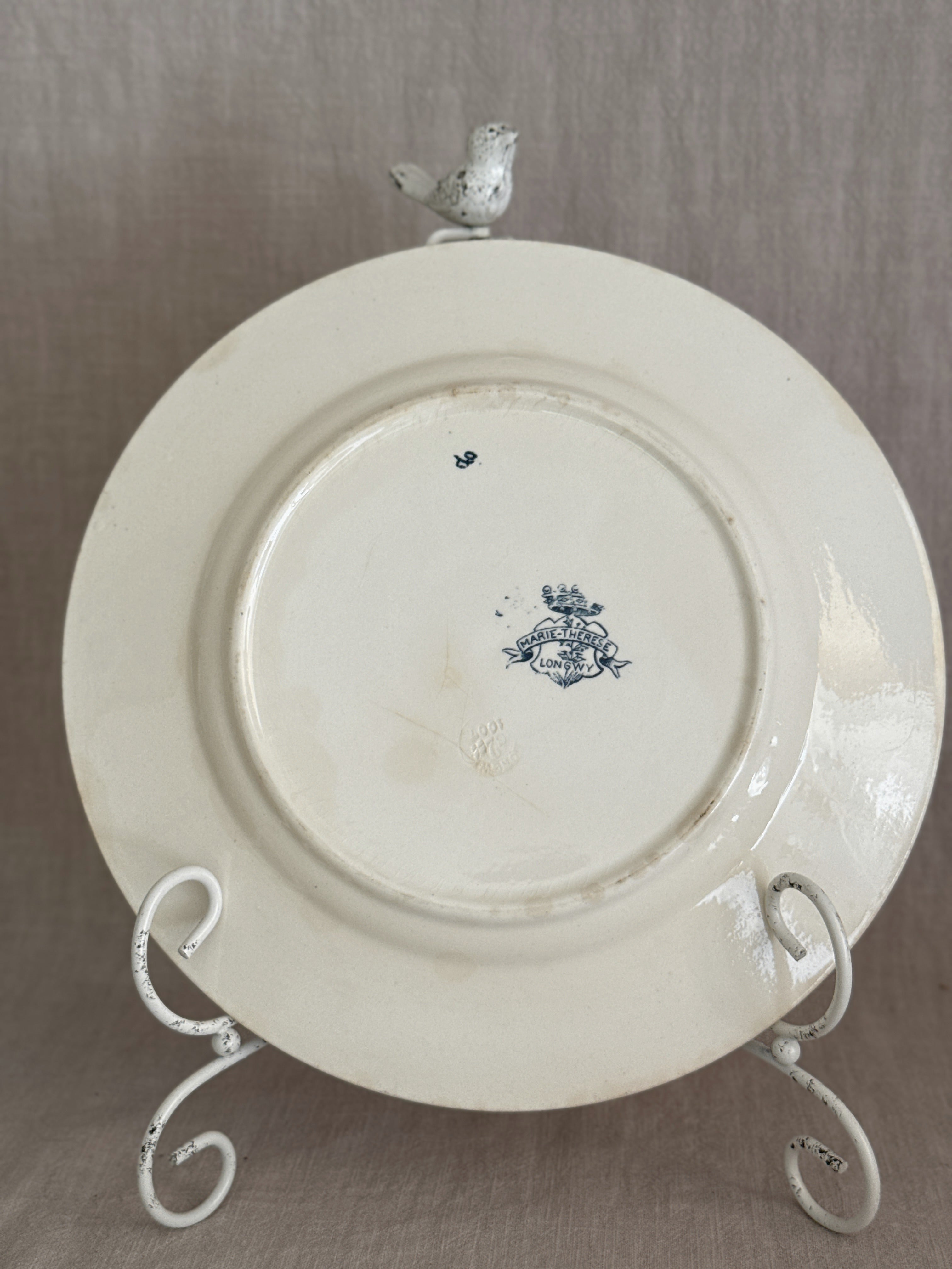 Back of a Longwy plate with the printed crowned shield mark reading MARIE-THERESE on a ribbon over LONGWY