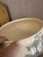 Rim of the antique French tureen seen from above, showing the small nick to the edge