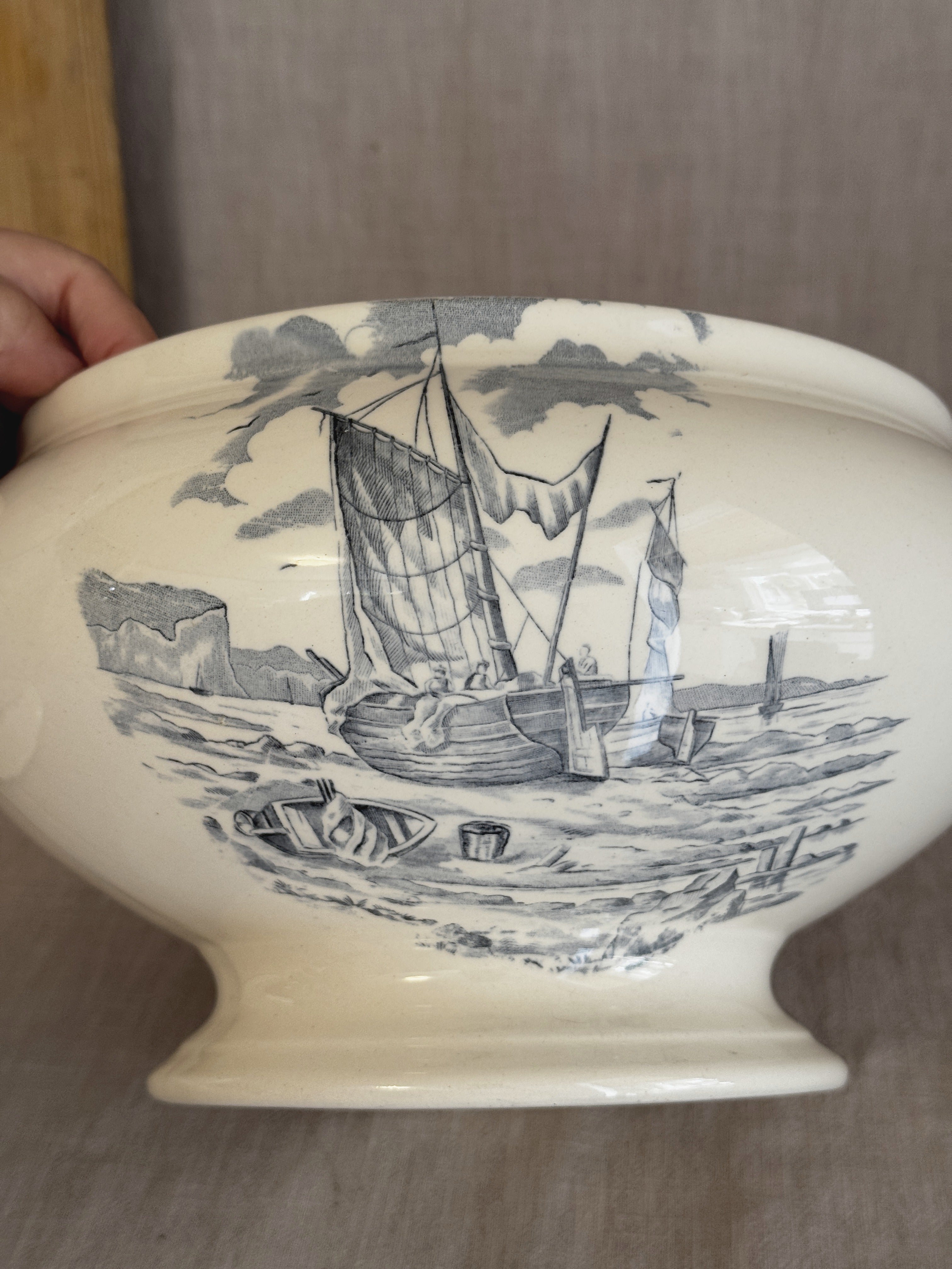 Close view of the fishing boat and chalk cliff transfer scene on the body of the Longchamp tureen