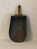 Vintage Swedish grain scoop with a broad dark patinated metal blade and a turned wooden handle